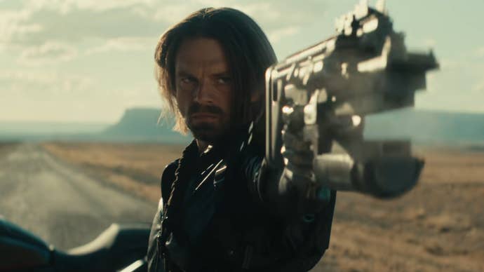 Bucky Barnes in Thunderbolts on a long stretch of road in the middle of nowhere, pointing a gun at something offscreen.