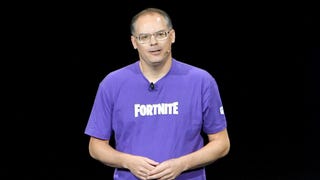 Epic CEO Tim Sweeney in purple Fortnite t-shirt on black background