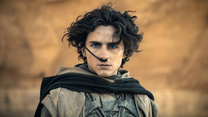 Timothee Chalamet as Paul Atreides in Dune 2, he’s stood with a serious expression, a tube connected to his nose.