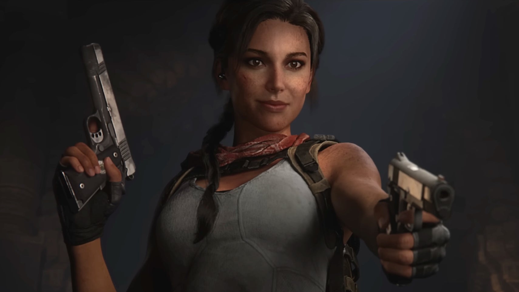 Tomb Raider: Catalyst trailer image showing Lara Croft smiling and pointing a gun at someone offscreen.