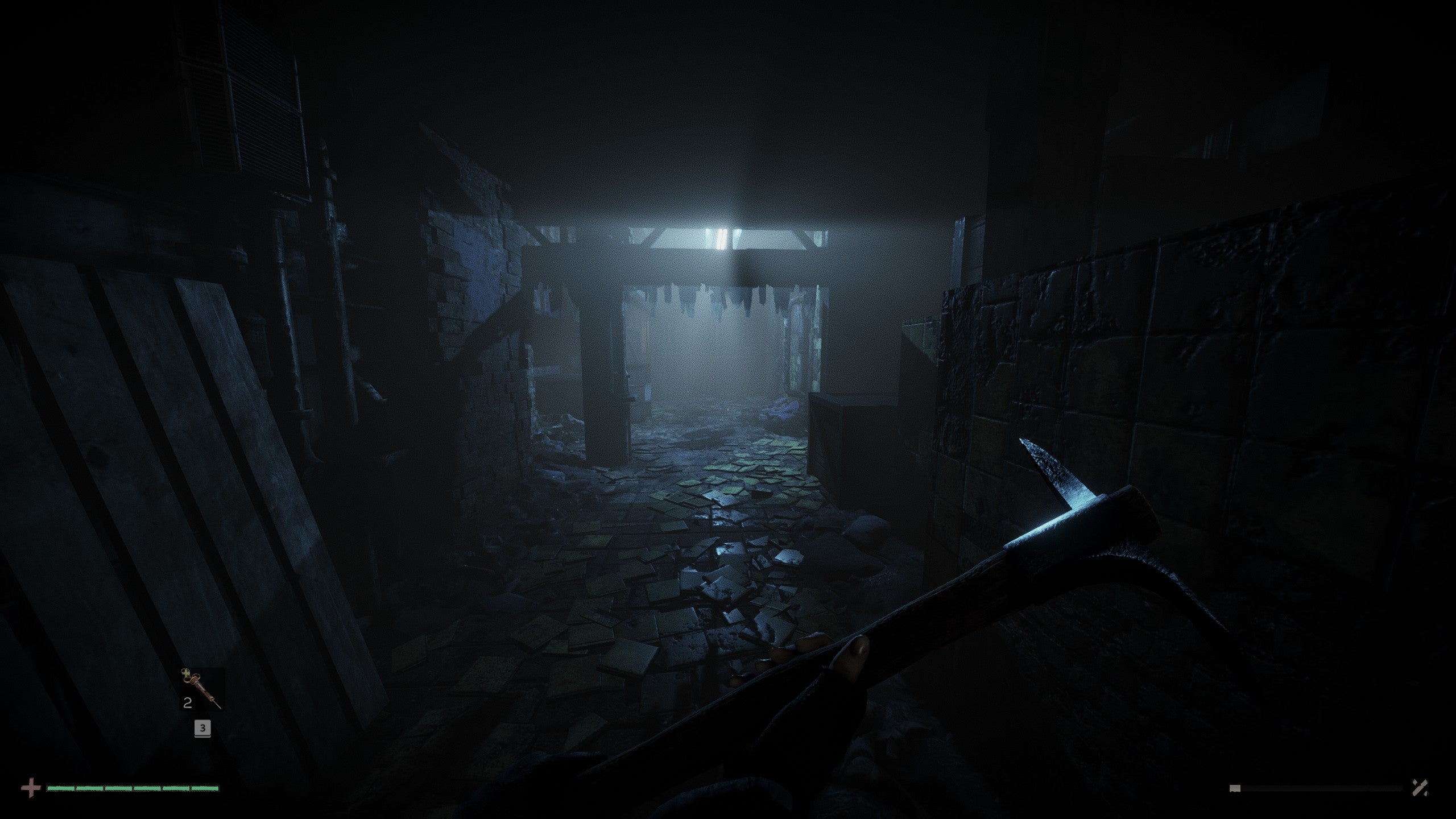 A screenshot from Total Chaos showing a murky corridor with broken tables and detritus strewn everywhere. In the nearground we see a character&rsquo;s hands holding a pickaxe.
