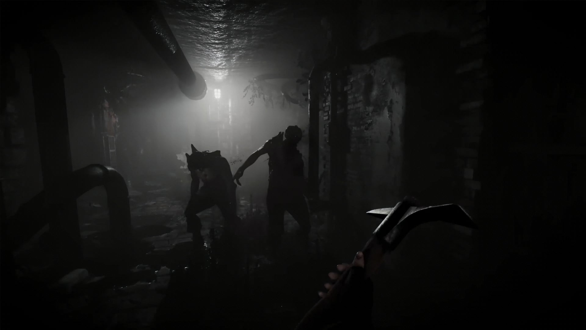 A screenshot from the Total Chaos trailer, showing the player attacking two demons with a pickaxe. - 3