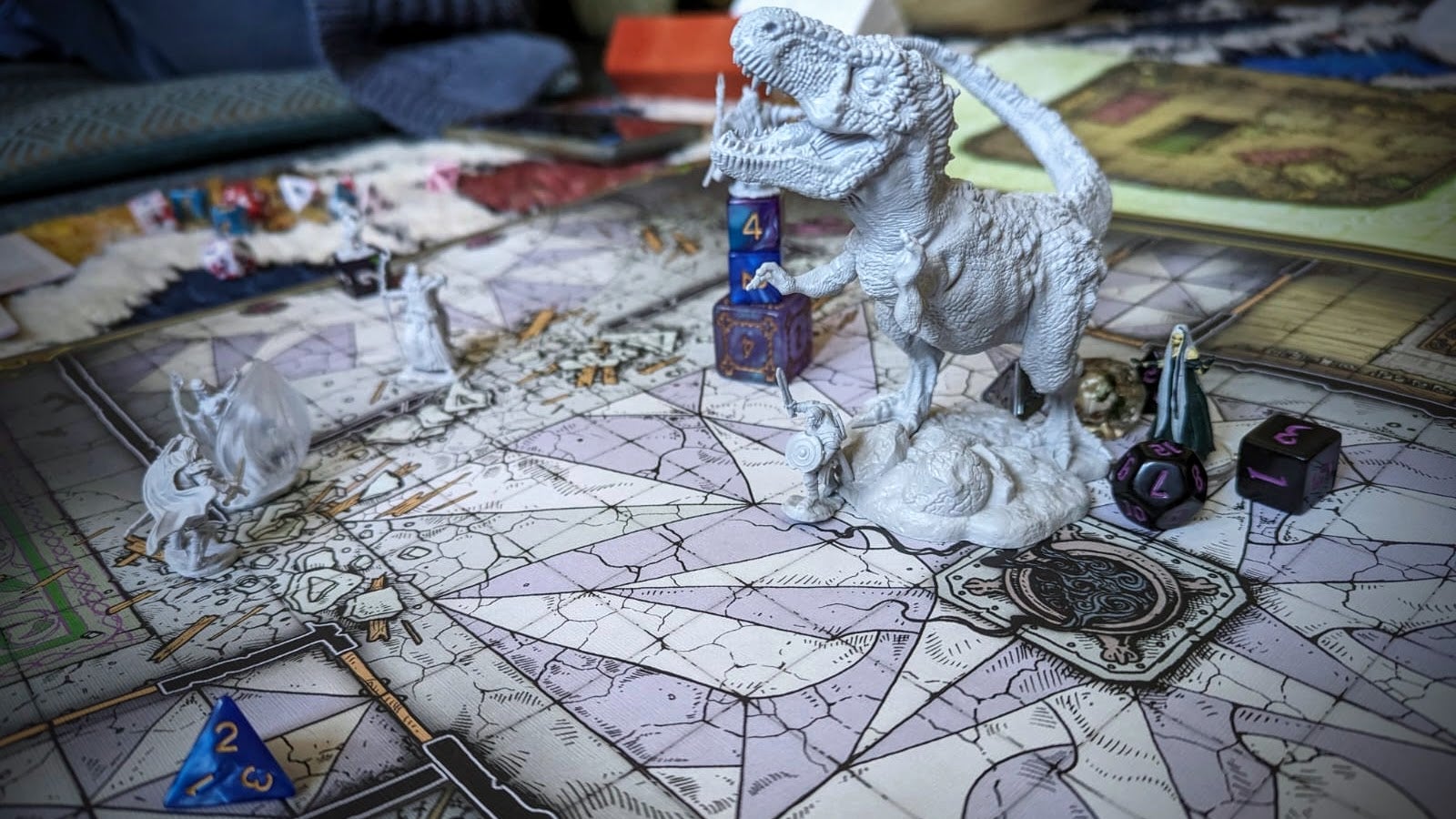 A photograph of a large, poster-sized Dungeons &amp; Dragons floor map with various miniatures placed on top. There are a few fantasy humanoids around but the undeniable focus of the scene is a gigantic T rex. That&rsquo;s Bertie, that is, polymorphed for the occasion. It kept him in the fight.