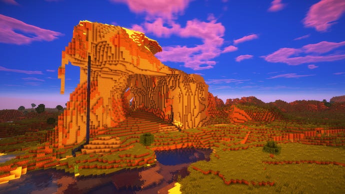 A Minecraft extreme hills biome, with a waterfall running from the top of the hill down into the river below.