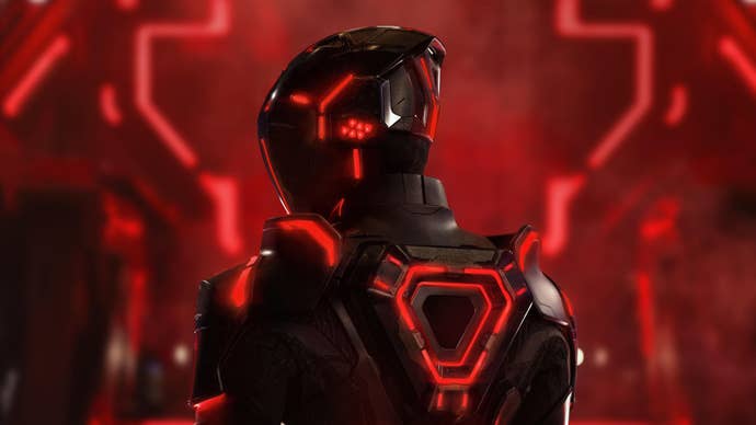 A person from Tron: Ares in a black suit with red accented lights.