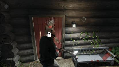 Jason swings an axe at a cabin door in Friday the 13th