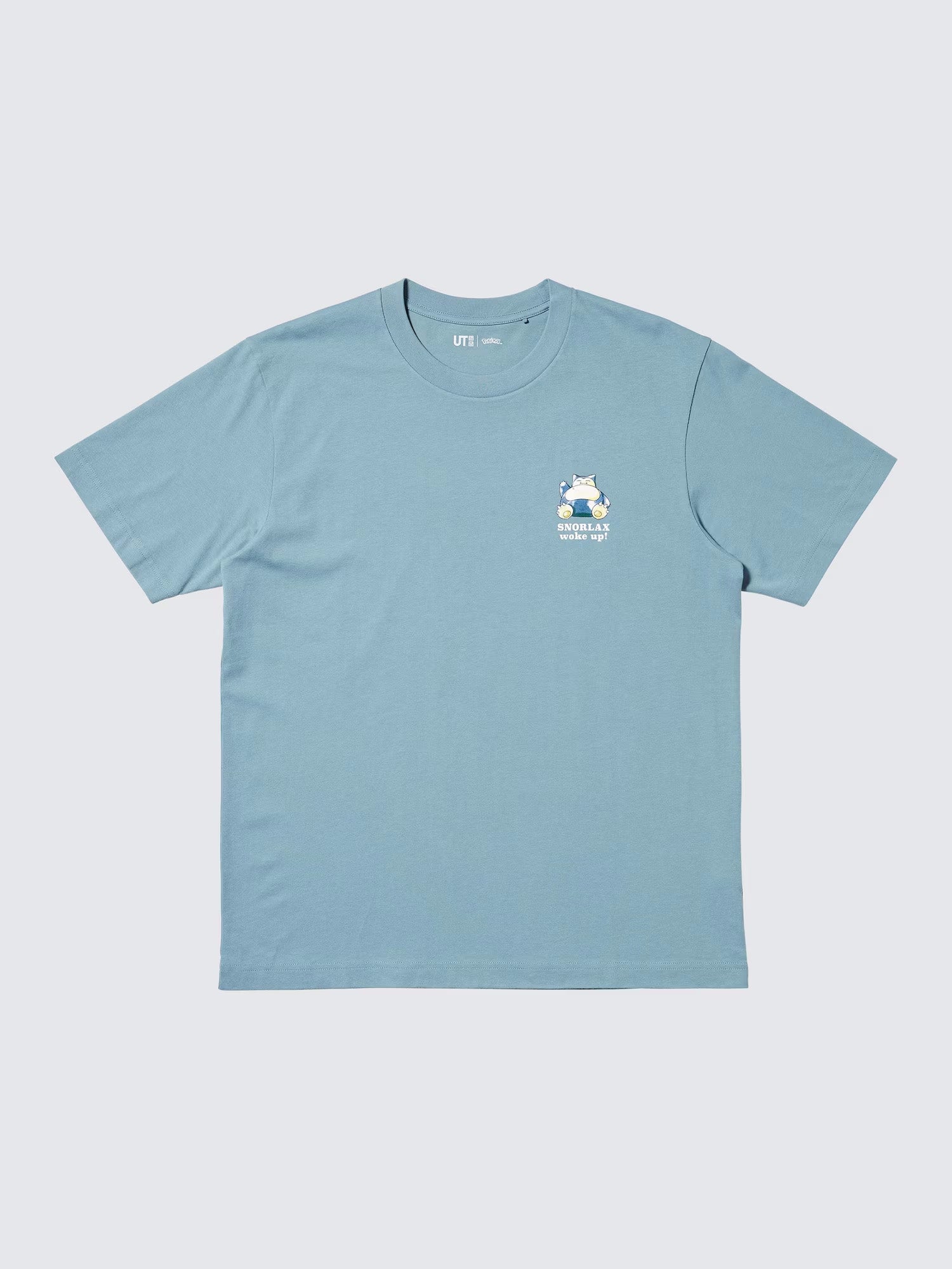 A blue-grey t-shirt showcasing a simple design with a Snorlax character situated where a left pocket would be.