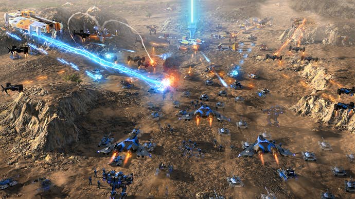 A sprawling brownish plateau betwixt rocky cliffs with hundreds of metallic subject units shooting beams and bullets astatine each other, from Ashes of the Singularity 2.