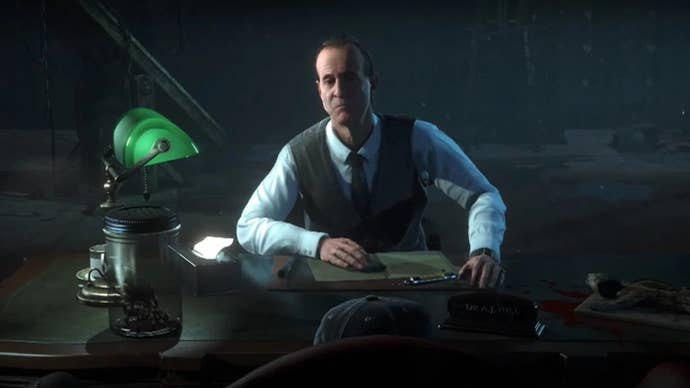 Peter Stormare as Dr Hill in Until Dawn, he is sat at a desk looking like he’s thinking about something.