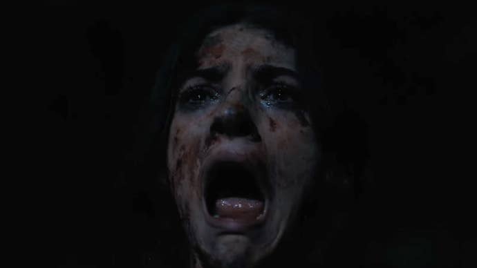 A close-up of a woman covered in dirt and blood in the Until Dawn movie, she is screaming.
