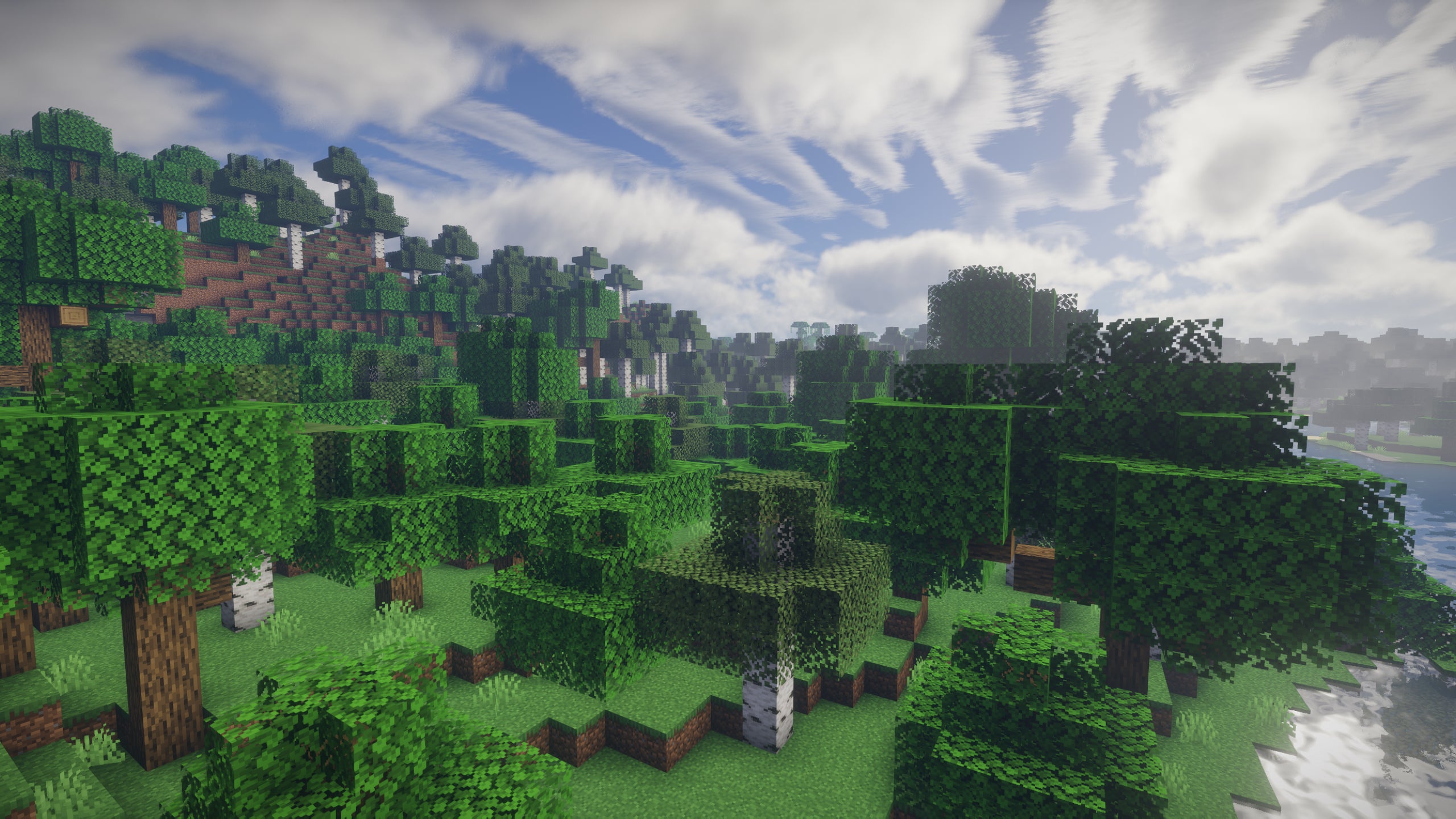 A forest scene in Minecraft with UShader shaders installed.