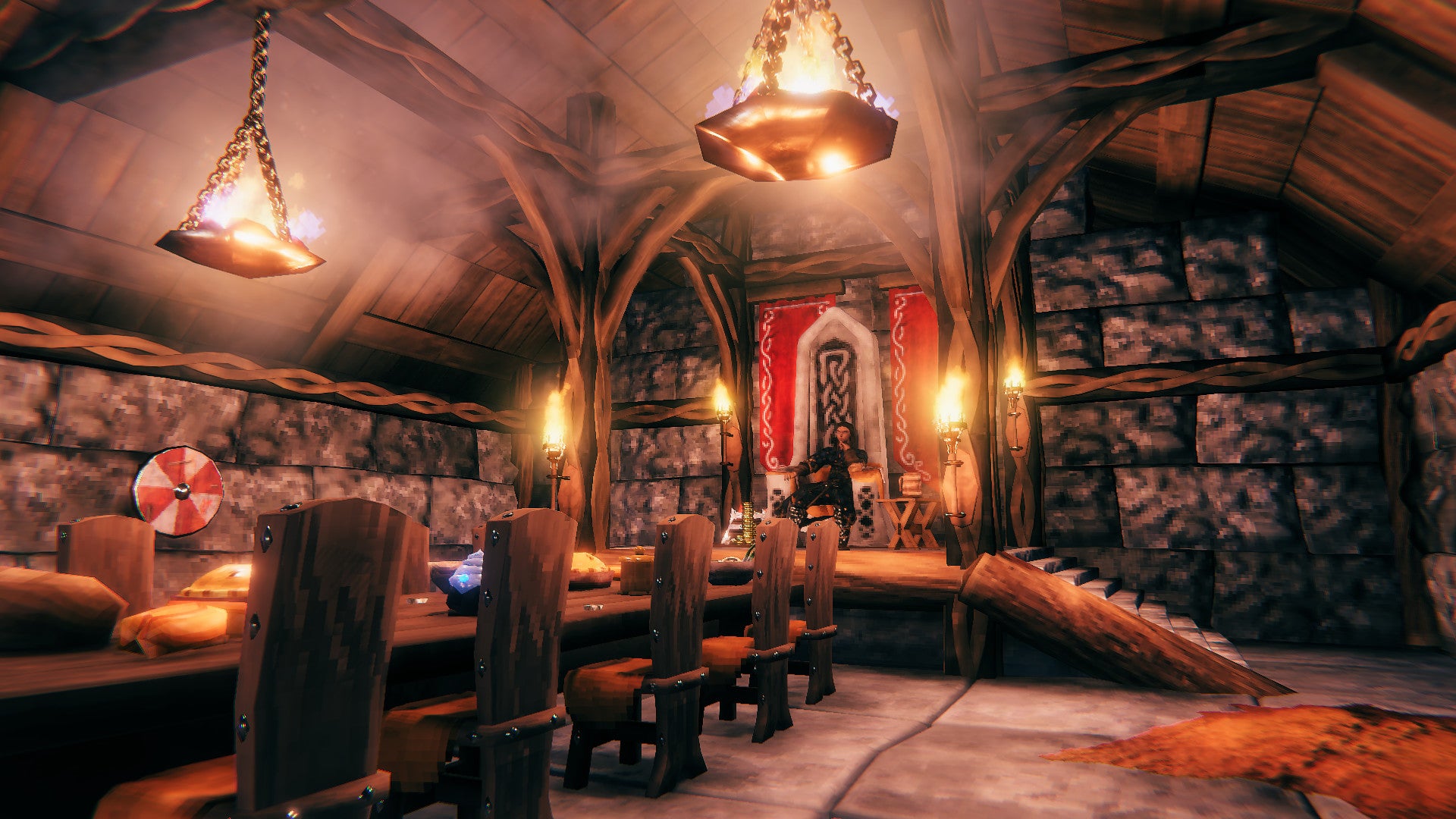 In interior of a Viking longhouse in Valheim&rsquo;s new Hearth &amp; Home update.