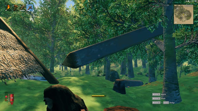 A felled tree in Valheim, the trunk having fallen and partially lodged in another nearby tree