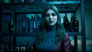 A pretty feminine character wearing a high-buttoned black frilly blouse, with a purple coat over the shoulders, and long, centre-parted hair and pale skin, looks at the camera. She's sitting in a dirty and dark store room, it looks like.