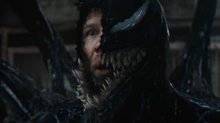 A still from Venom: The Last Dance of Tom Hardy as Eddie Brock, half of his face visible underneath Venom.