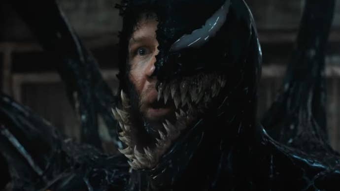 A still from Venom: The Last Dance of Tom Hardy as Eddie Brock, half of his face visible underneath Venom.