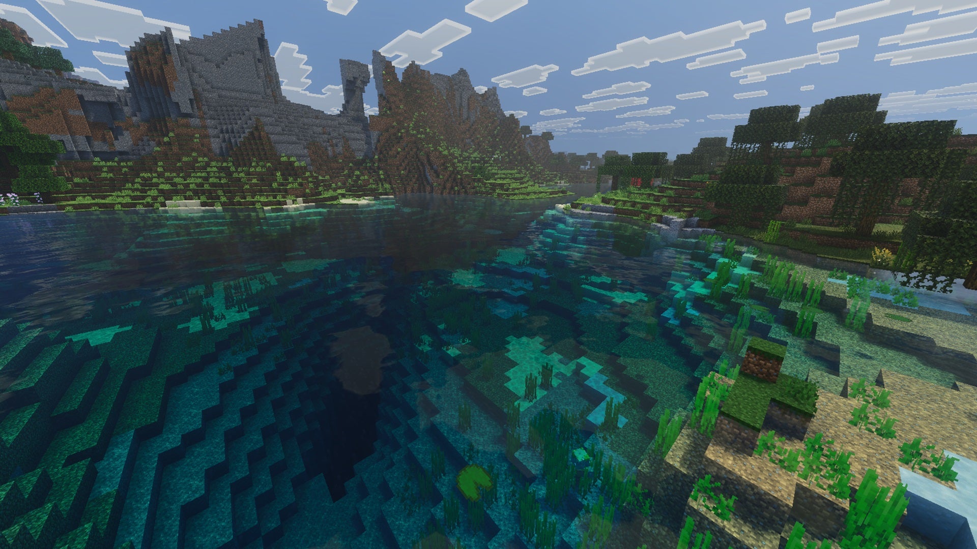 A lake in Minecraft Bedrock, with greater contrast and water wave effects courtesy of the Vibrant Vanilla PBR texture pack. - 15