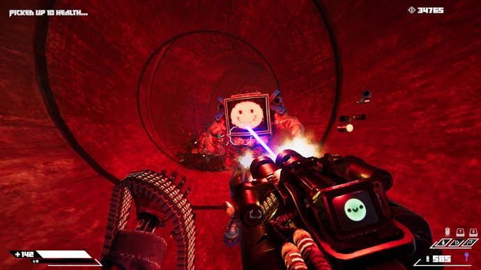 Johnny Turbo fires a minigun at a huge lad with a smiling TV for a head in Turbo Overkill.