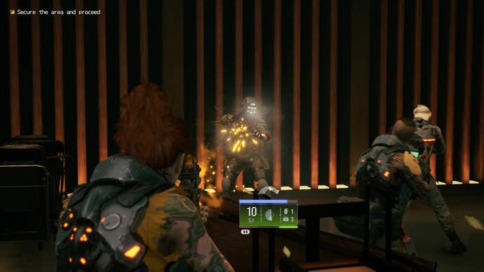 Stone shoots an armoured goon while Herzog and Doc stand there in Wanted: Dead.