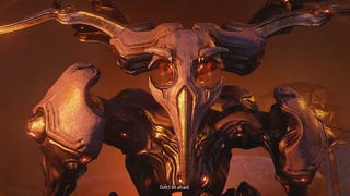 A screenshot of Warframe showing a terrible giant. The subtitle reads, "Don't be afraid."