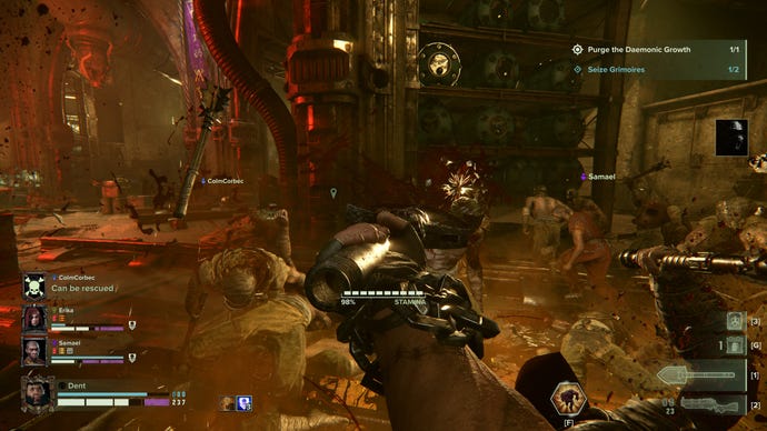 Cutting through hordes in a meaty sewer in a Warhammer 40,000: Darktide screenshot.