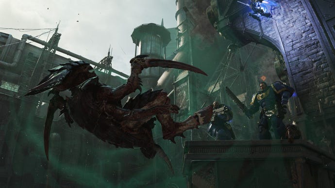 A tyranid is kicked off a high platform by Titus.