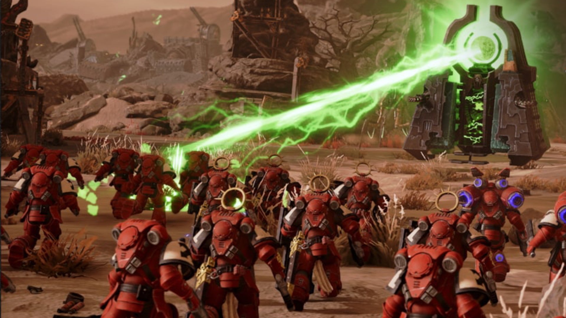 Soldiers running towards an energy beam in Warhammer 40,000: Dawn of War 4. - 1