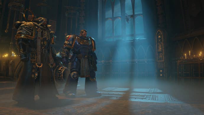 Titus and the chaplain stand in a dimly lit chapel.