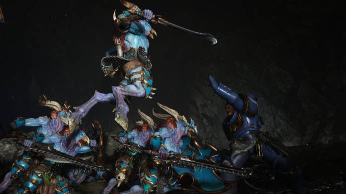 Titus raises his arm to catch a chaos enemy as it leaps on him.