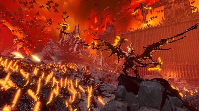 A red demon roars as his army charges forward in Total War: Warhammer 3