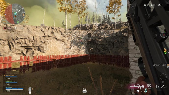 My teammate attempts to climb a rocky slope in Warzone, to no avail.