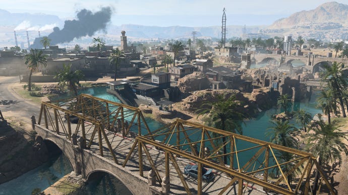 A bird’s eye view of a bridge and the nearby village in Al Mazrah, the Warzone 2.0 map.