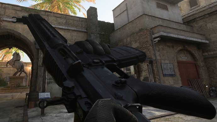 The player in Warzone 2.0 inspects their weapon, the FTAC Recon.