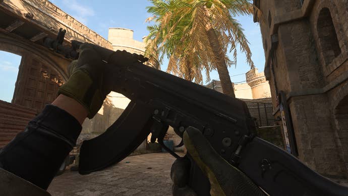 The player in Warzone 2.0 inspects their weapon, the Kastov-762.