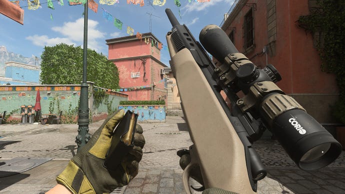 The player in Warzone 2.0 inspects their weapon, the LA-B 330.