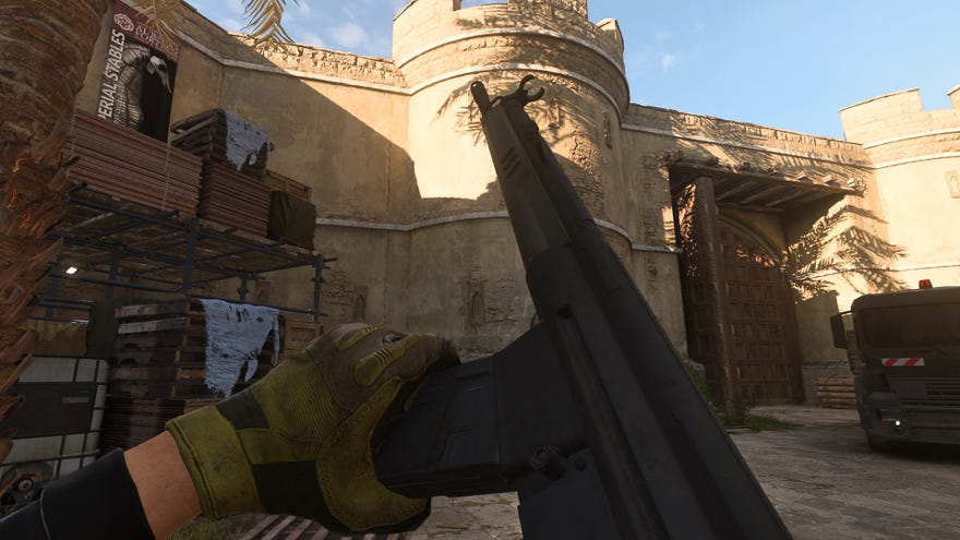 The player in Warzone 2.0 inspects their weapon, the Lachmann-762.