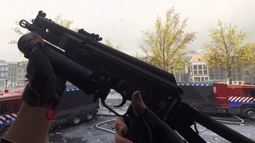 The player in Warzone 2.0 inspects their weapon, the Minibak.