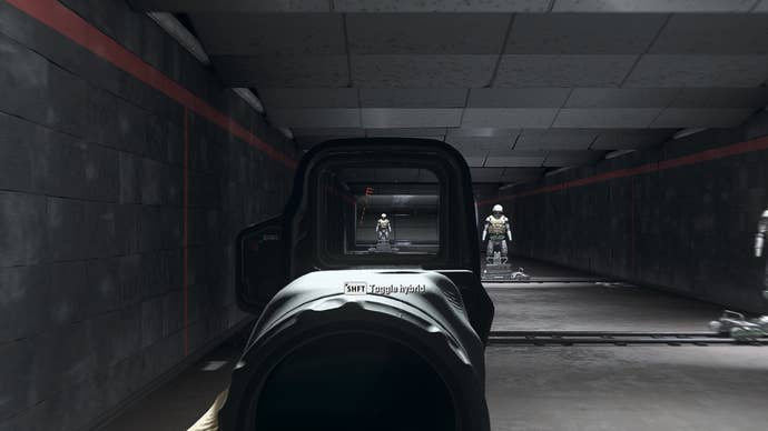 The player in Warzone 2.0 aims at a training dummy using the Angel-40 4 8x optic attachment.