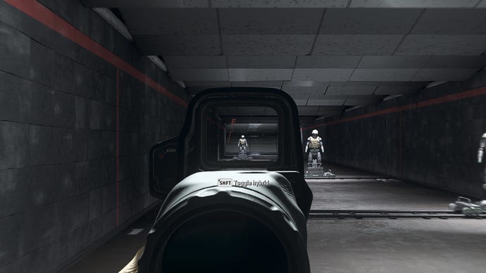 The player in Warzone 2.0 aims at a training dummy using the Angel-40 4 8x optic attachment.