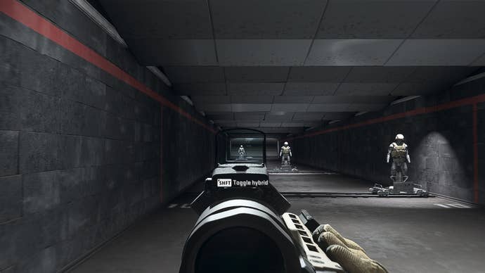 The player in Warzone 2.0 aims at a training dummy using the Ares Clear Shot optic attachment.