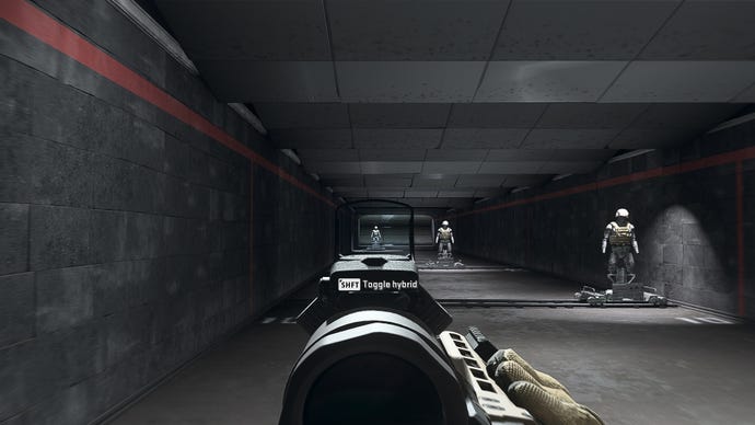 The player in Warzone 2.0 aims at a training dummy using the Ares Clear Shot optic attachment.