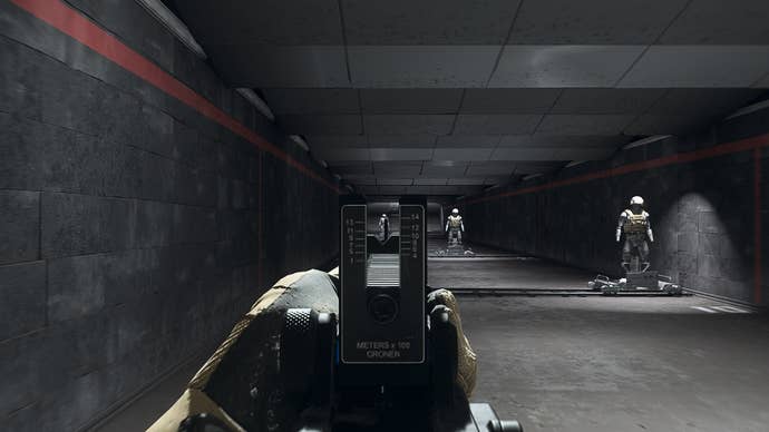 The player in Warzone 2.0 aims at a training dummy using the Cronen Irons optic attachment.