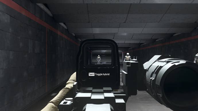 The player in Warzone 2.0 aims at a training dummy using the DR582 Hybrid Sight optic attachment.