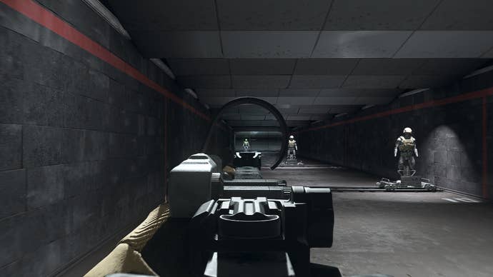 The player in Warzone 2.0 aims at a training dummy using the Monocle CT90 optic attachment.