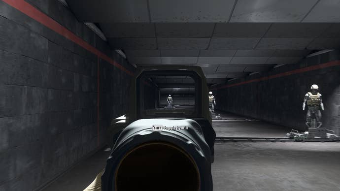 The player in Warzone 2.0 aims at a training dummy using the Therm Optic x9 optic attachment.
