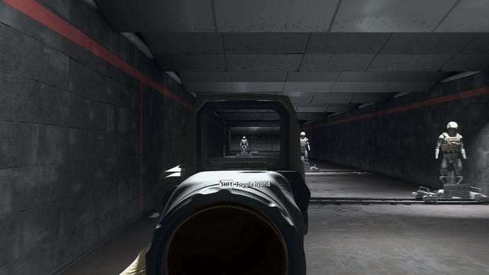 The player in Warzone 2.0 aims at a training dummy using the Therm Optic x9 optic attachment.