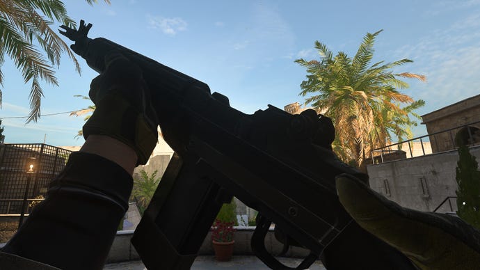 The player in Warzone 2.0 inspects their weapon, the S0-14.