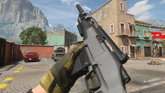 The player in Warzone 2.0 inspects their weapon, the SA-B 50.