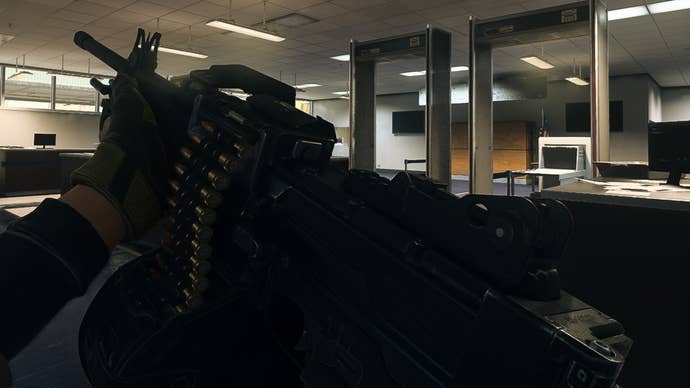 The player in Warzone 2.0 inspects their weapon, the Sakin MG38.