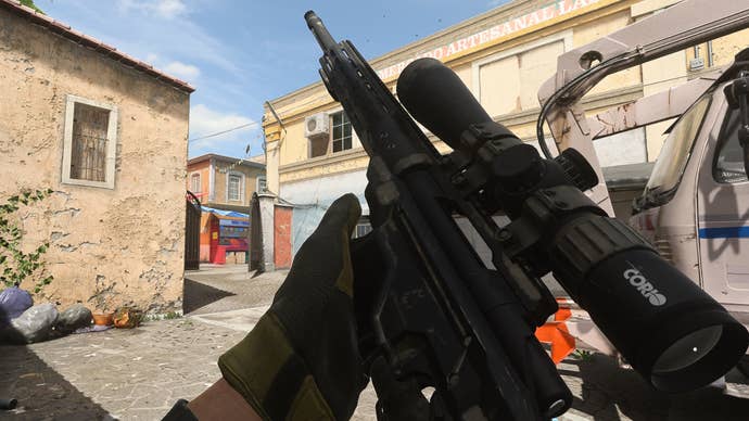 The player in Warzone 2.0 inspects their weapon, the SP-X 80.